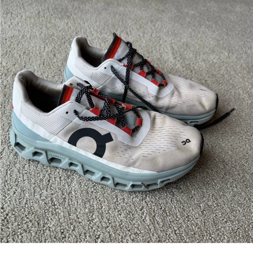 On Running Men’s White Running Shoes with Light Blue Soles and Red Accents